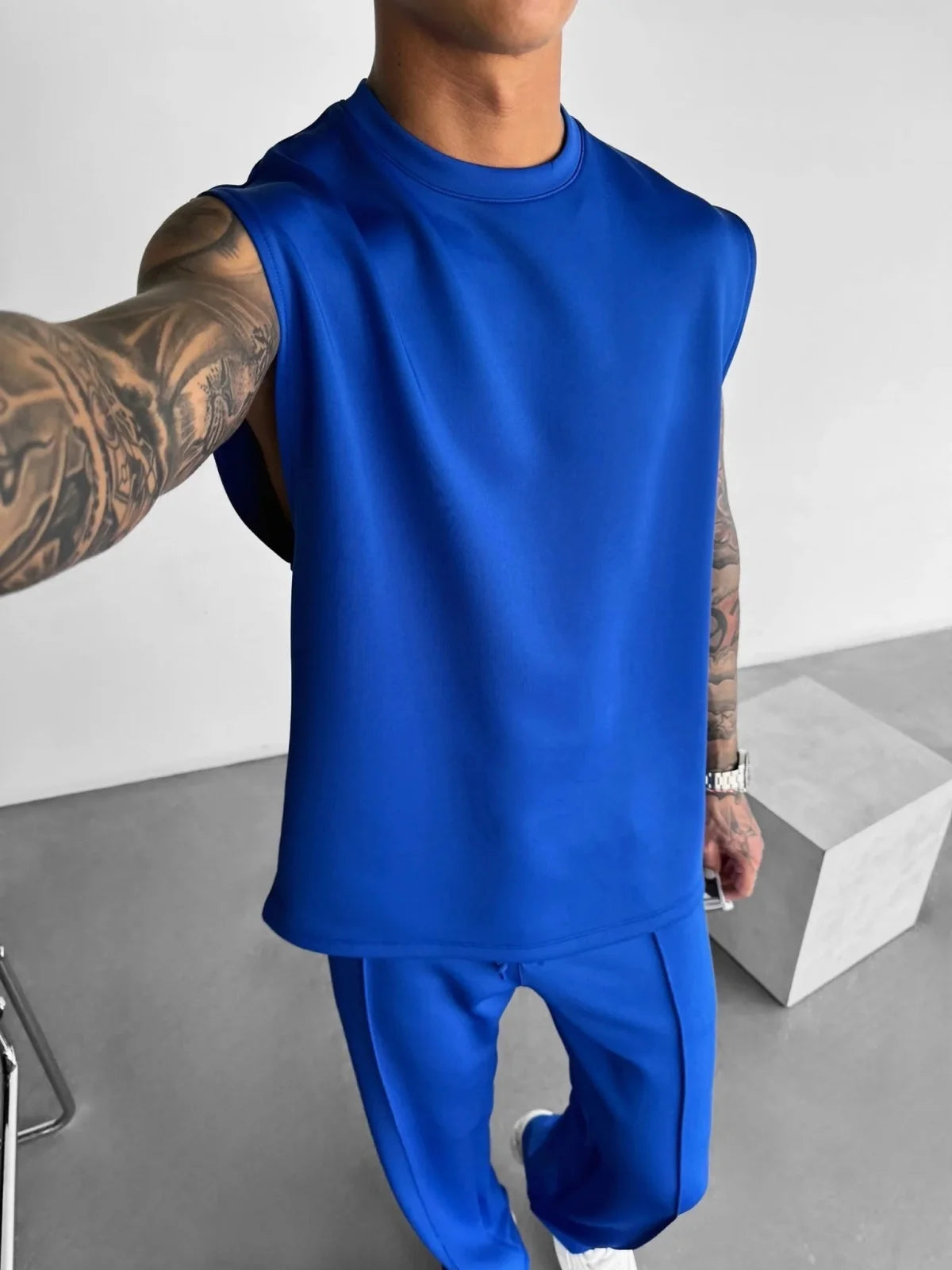 2025 Verão novo masculino moda esportiva calças casuais colete conjunto solto sem mangas T-shirt conjunto de cor sólida