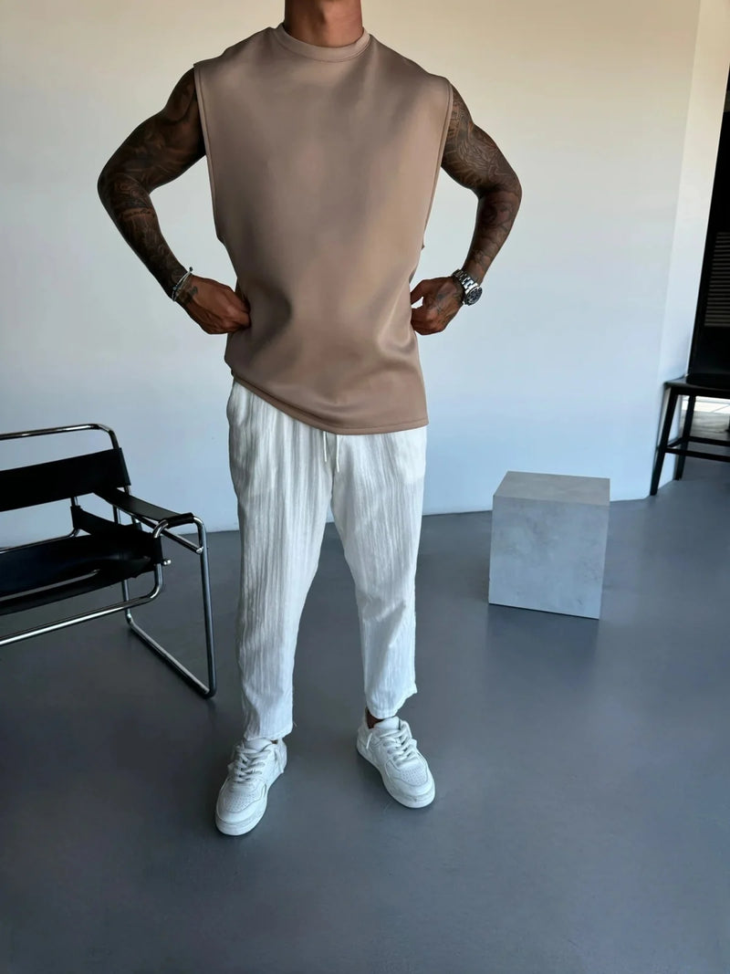 2025 Verão novo masculino moda esportiva calças casuais colete conjunto solto sem mangas T-shirt conjunto de cor sólida