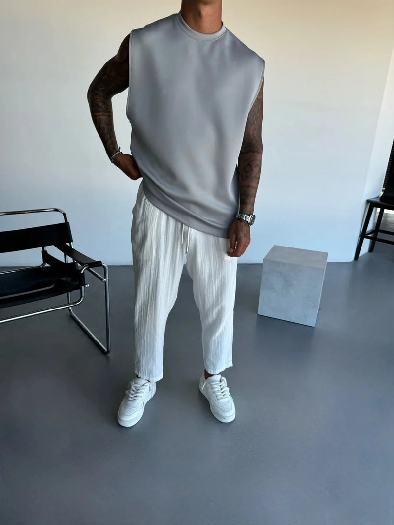 2025 Verão novo masculino moda esportiva calças casuais colete conjunto solto sem mangas T-shirt conjunto de cor sólida